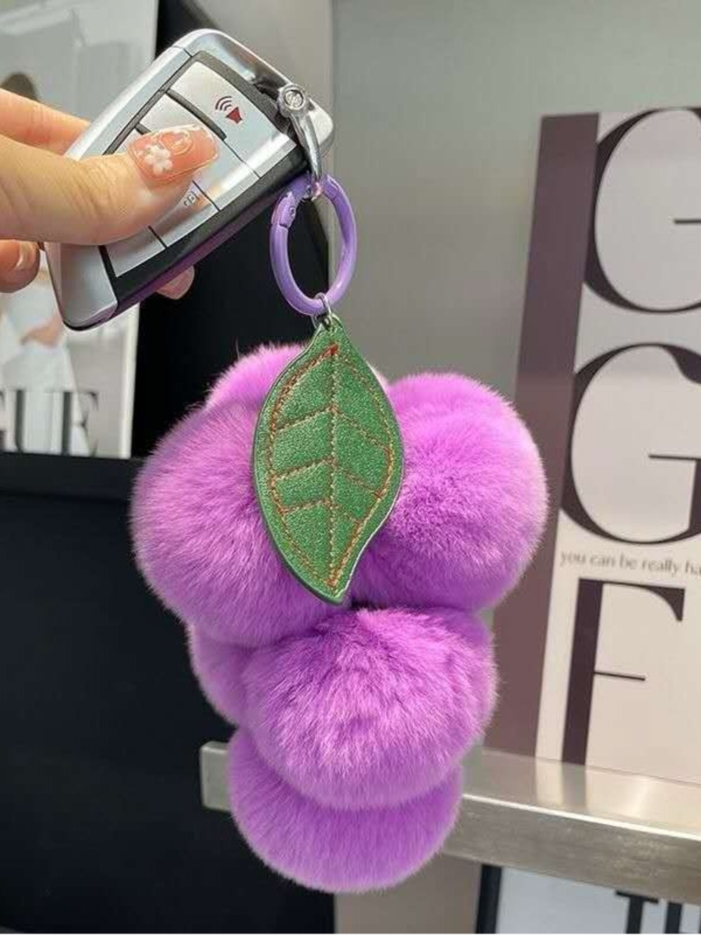Plush Purple Pom Pom Keychain with Green Leaf Charm
